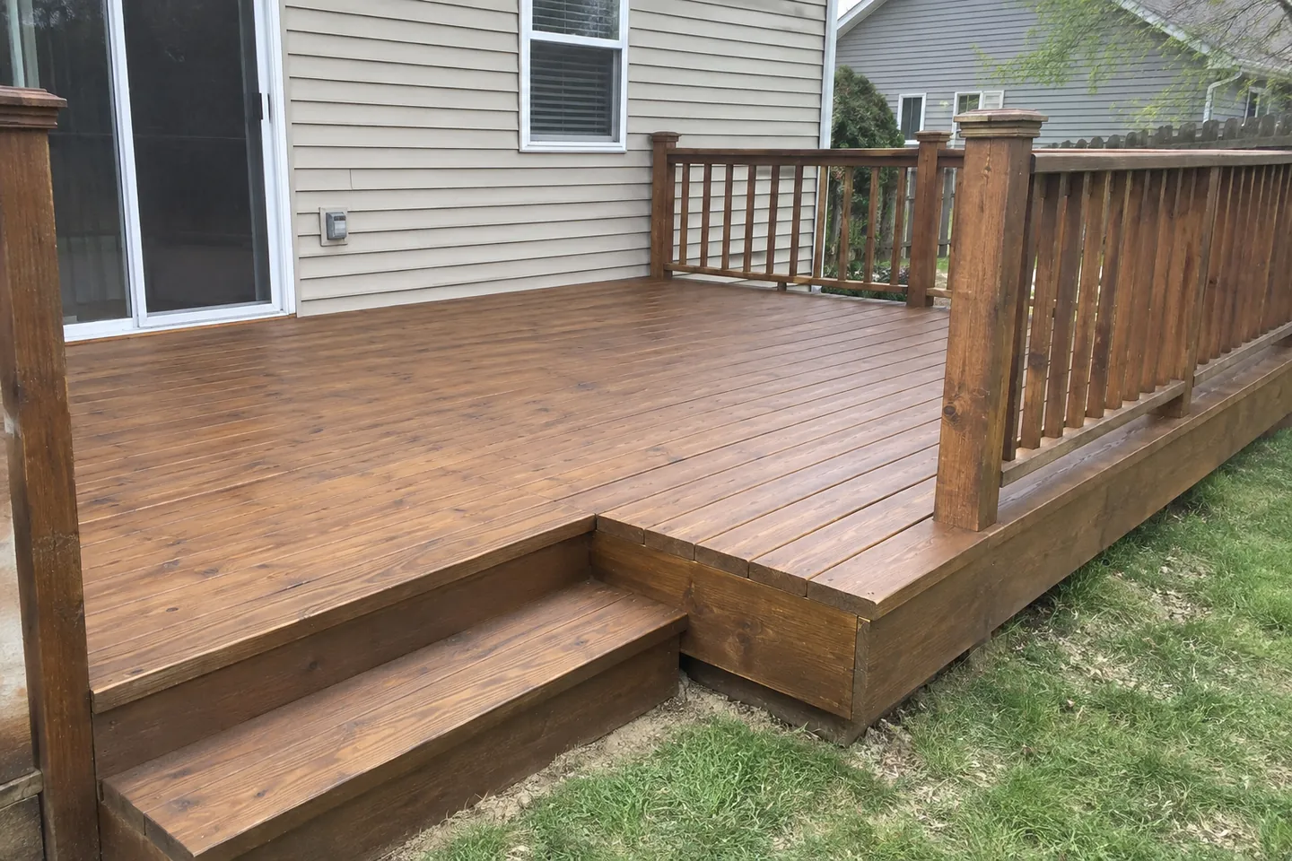 Wooden deck with a matte cedar-brown stain and visible grain